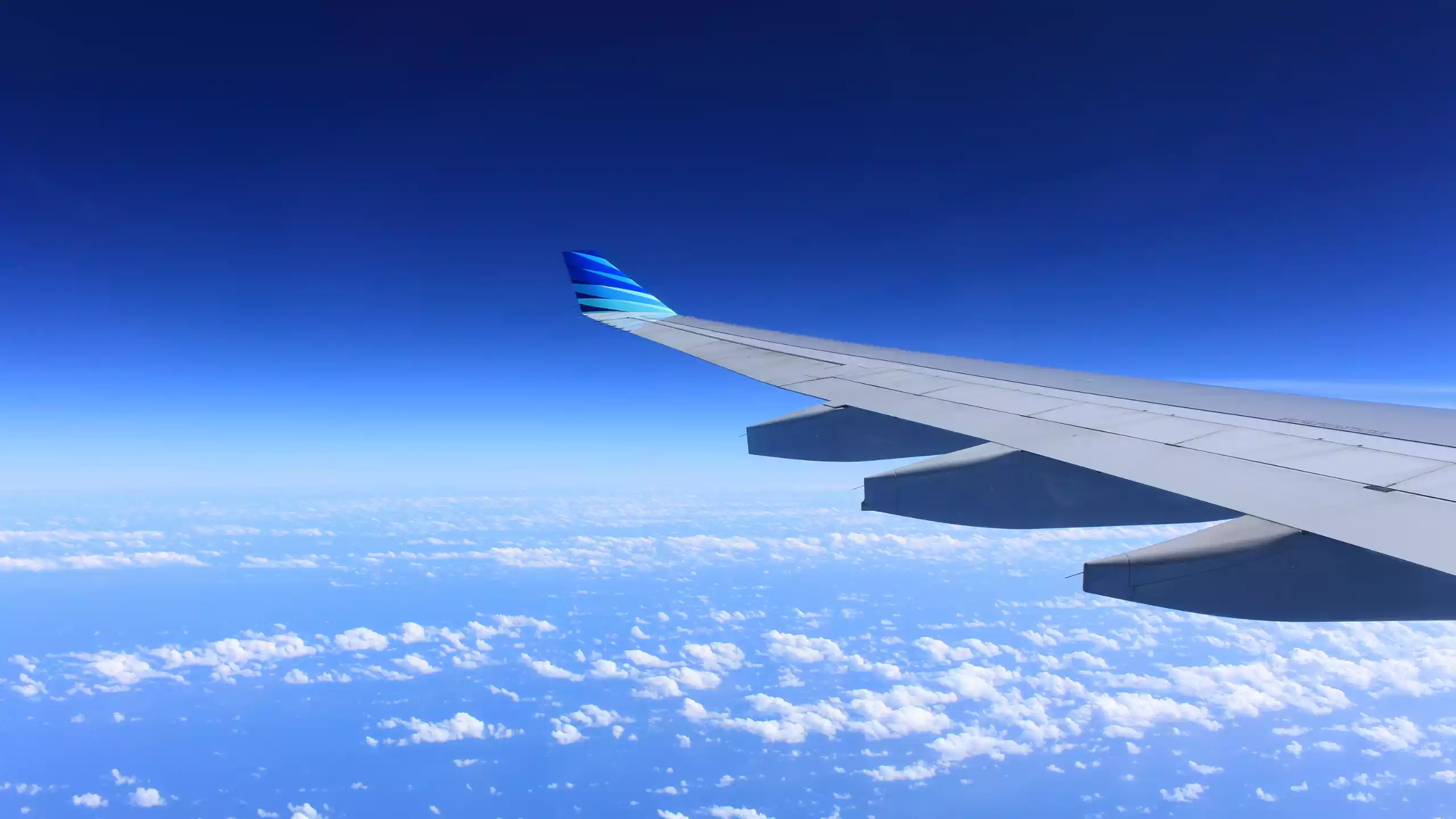 Looking out a plane window, wing in view